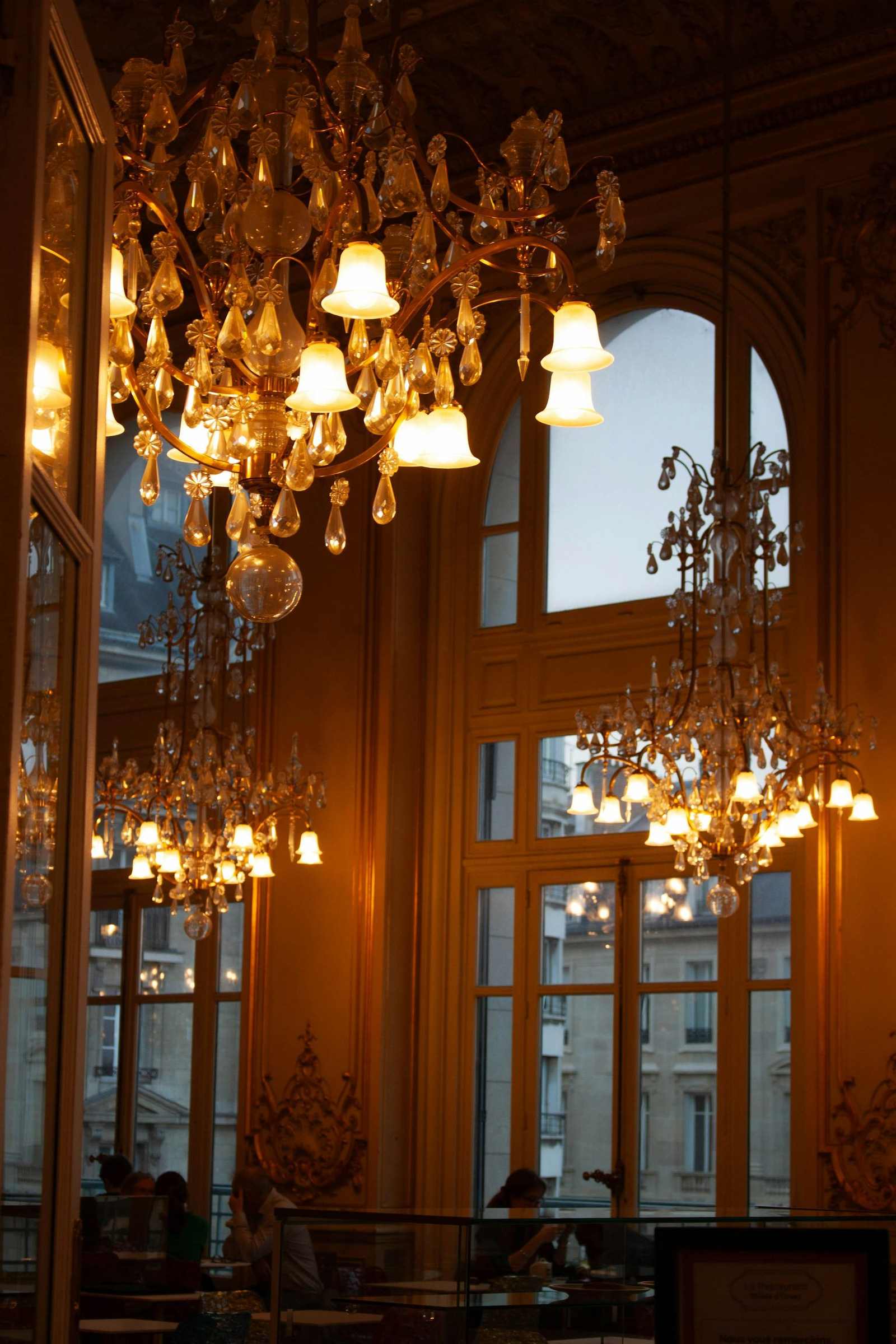 Interior with lavish chandeliers and tall windows